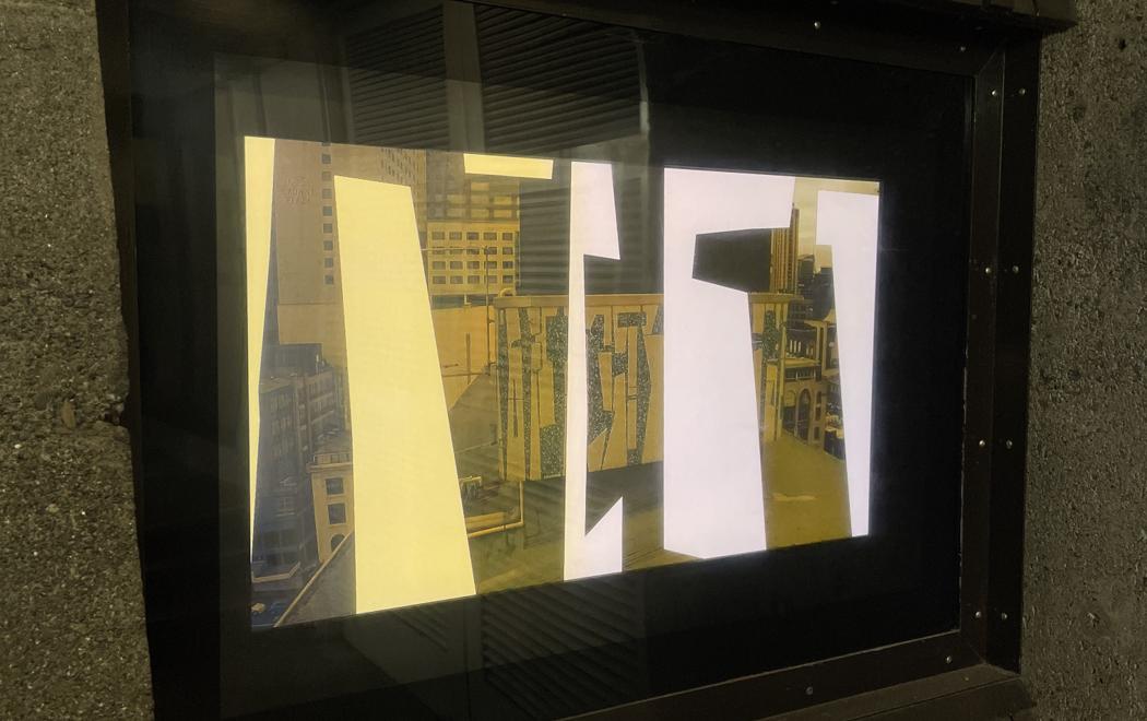 A close-up of an inset video screen sited in a pedestrian walkway